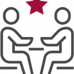Personalberater 2 Peronen sitzen gegenüber an einem Tisch mit Stern -Icon